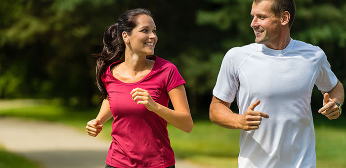 Husband and Wife out on a jog follow health advice from Cary chiropractor