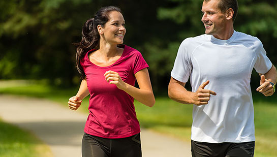 Husband and Wife out on a jog follow health advice from Cary chiropractor