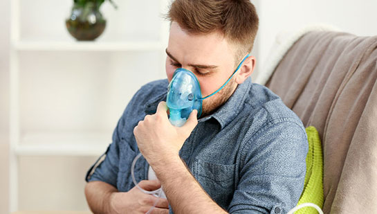 Man struggling with Asthma before chiropractic treatment from Cary chiropractor
