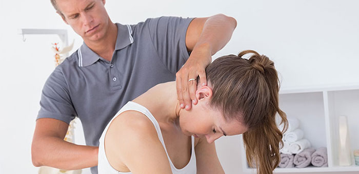 Woman receiving chiropractic adjustment from a Cary chiropractor
