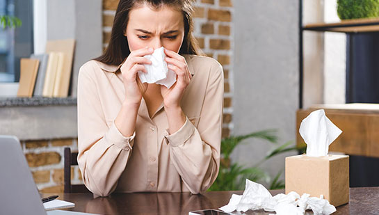 Woman suffering from severe allergies before chiropractic adjustments from Cary chiropractor