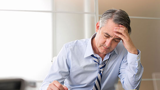 Man with chronic stress before chiropractic treatment from Cary chiropractor