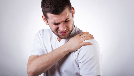 Man suffering from frozen shoulder before visiting Cary chiropractor