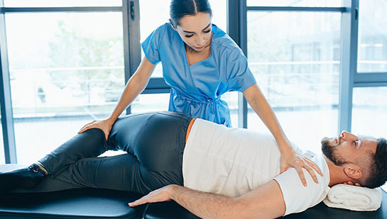 Patient receiving sciatica treatment from Cary chiropractor